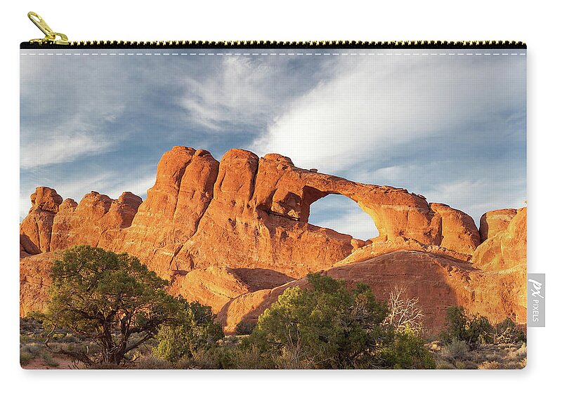 Colorful Zip Pouch featuring the photograph Late Afternoon Light on Skyline Arch by David Watkins