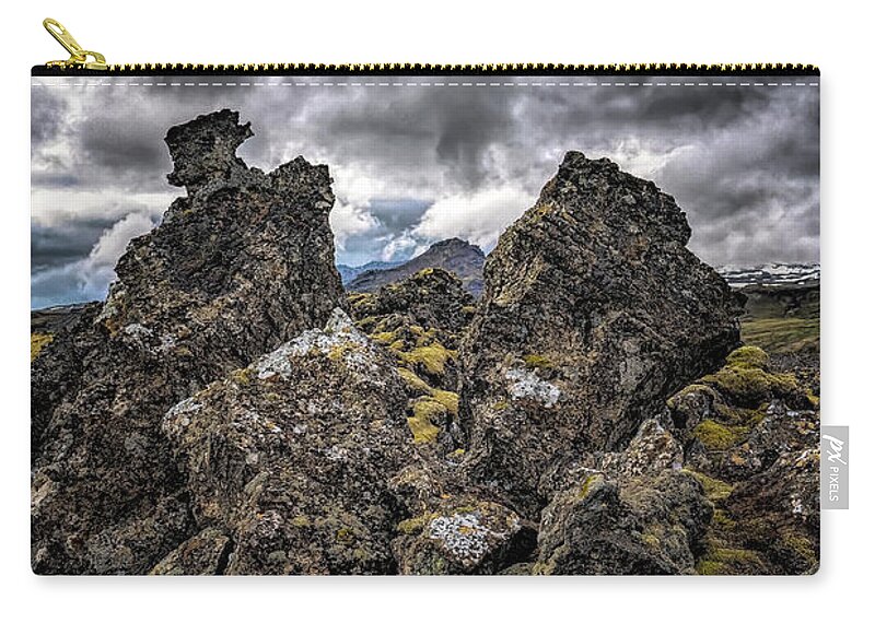 Iceland Zip Pouch featuring the photograph Lava Rock And Clouds by Tom Singleton