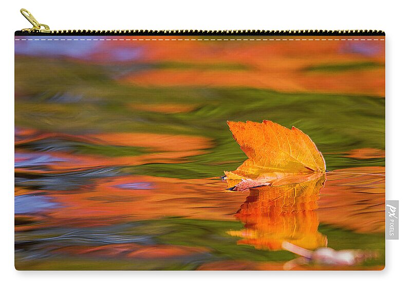 Fall Zip Pouch featuring the photograph Leaf on water by Benjamin Dahl
