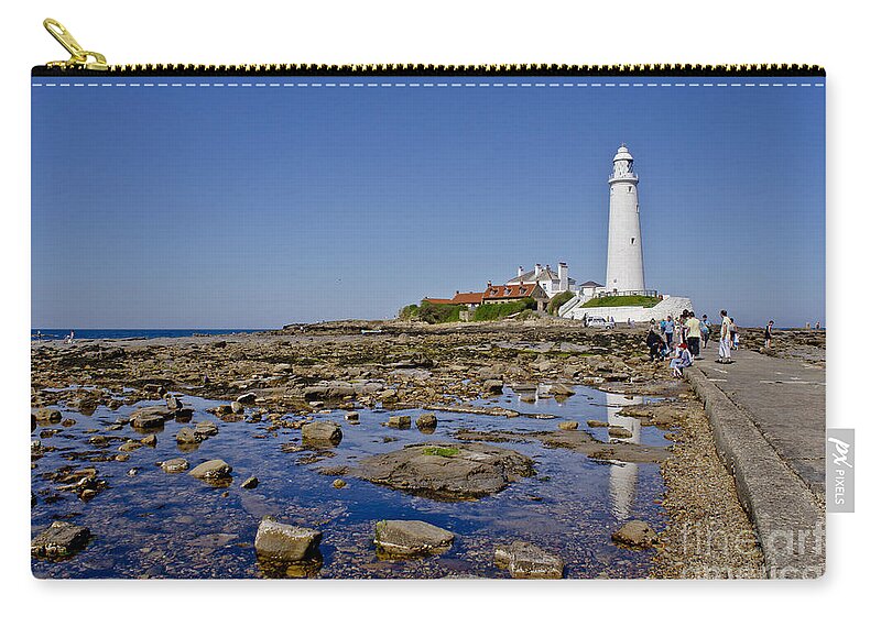 Lighthouse Zip Pouch featuring the photograph Lighthouse at low tide. by Elena Perelman