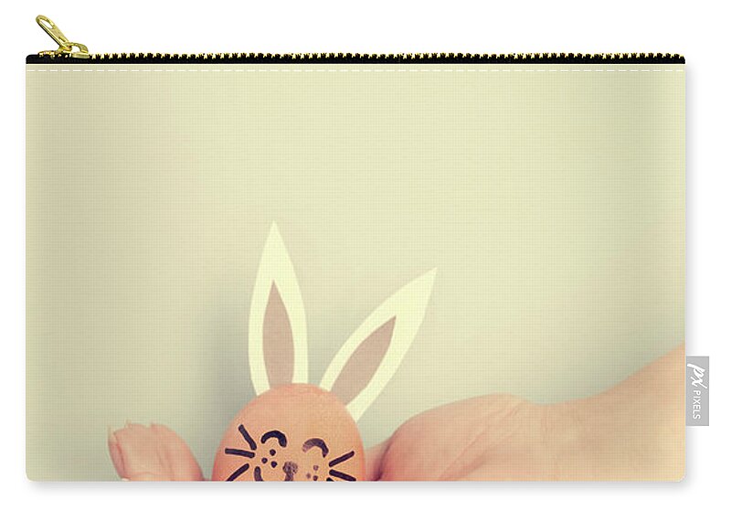Egg Zip Pouch featuring the photograph Little Easter bunny made from an egg by Michal Bednarek