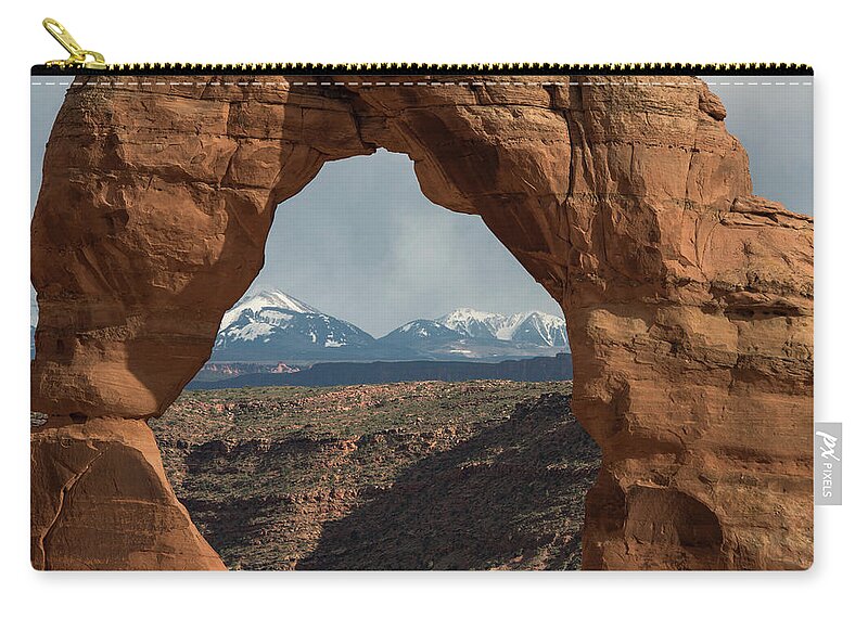 Delicate Zip Pouch featuring the photograph Looking Through Delicate Arch by Jennifer Ancker