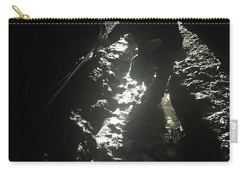 Kelly Hazel Zip Pouch featuring the photograph Man in the Cave by Kelly Hazel