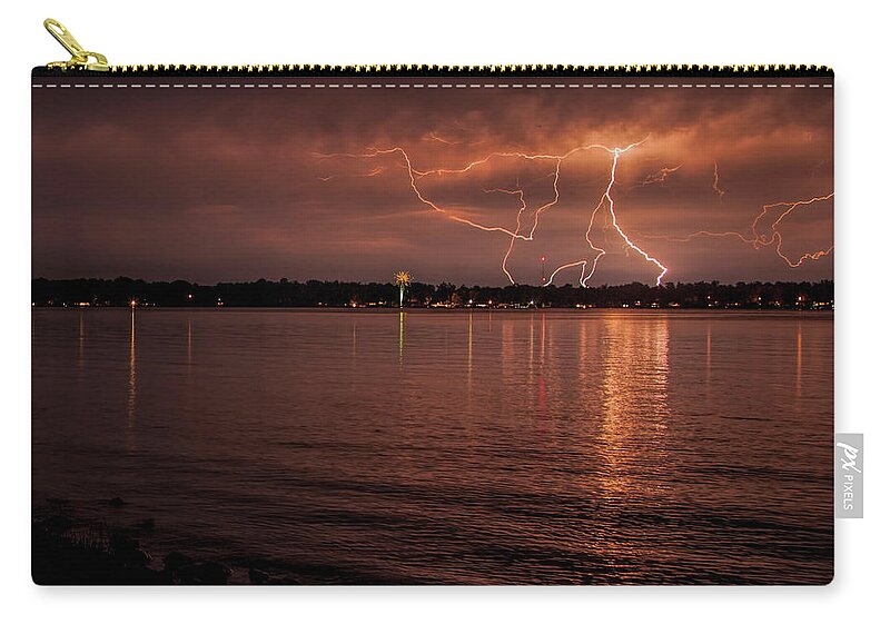 Lightning Zip Pouch featuring the photograph Man made and Natural lightning by John Crothers