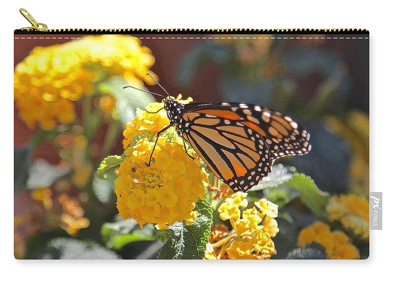 Monarch Zip Pouch featuring the photograph Monarch Butterfly on Lantana by Liz Vernand