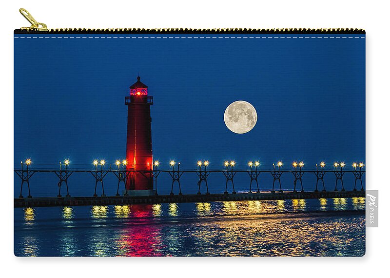 Grand Haven Zip Pouch featuring the photograph Moon over Grand Haven by Nick Zelinsky Jr
