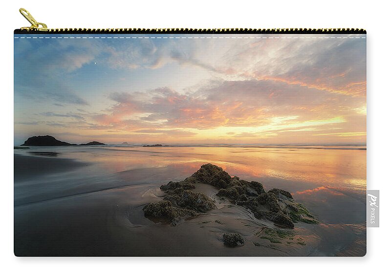 We Spent The Labor Day Weekend At Cannon Beach. I Really Love The Oregon North Coast. This Place Is Just So Unpredictable In Weather. I Got Skunked For 3 Mornings By Either That Pesky Marine Layer Or Flash Flooding Style Downpours. But The Sunsets Were Spectacular. This Was On Sunday. The Sky Really Lit Up So Beautifully. Zip Pouch featuring the photograph Moonrise at Hug Point by Ryan Manuel