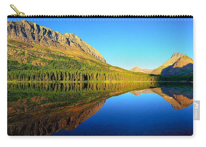Glacier National Park Zip Pouch featuring the photograph Morning Reflections at Fishercap Lake by Greg Norrell