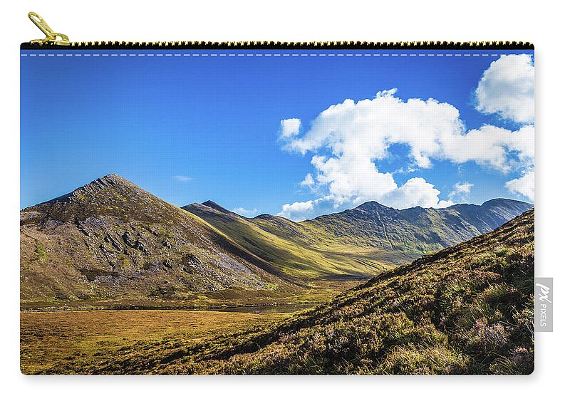 Beenkeragh Zip Pouch featuring the photograph Mountain range and valleys in Kerry in Ireland on a sunny day wi by Semmick Photo
