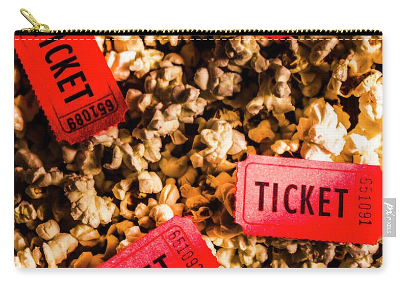 Movie Zip Pouch featuring the photograph Movie tickets on scattered popcorn by Jorgo Photography