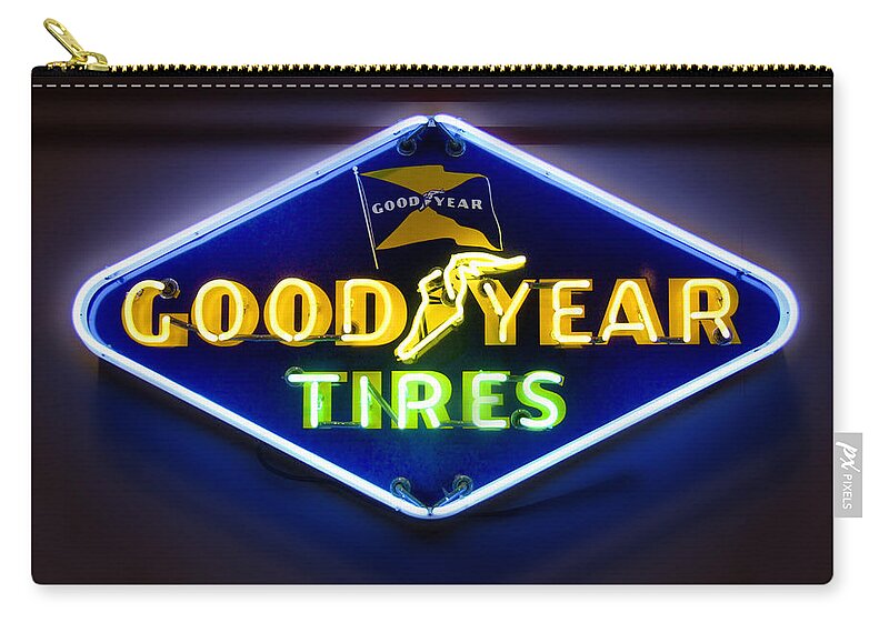 Transportation Carry-all Pouch featuring the photograph Neon Goodyear Tires Sign by Mike McGlothlen