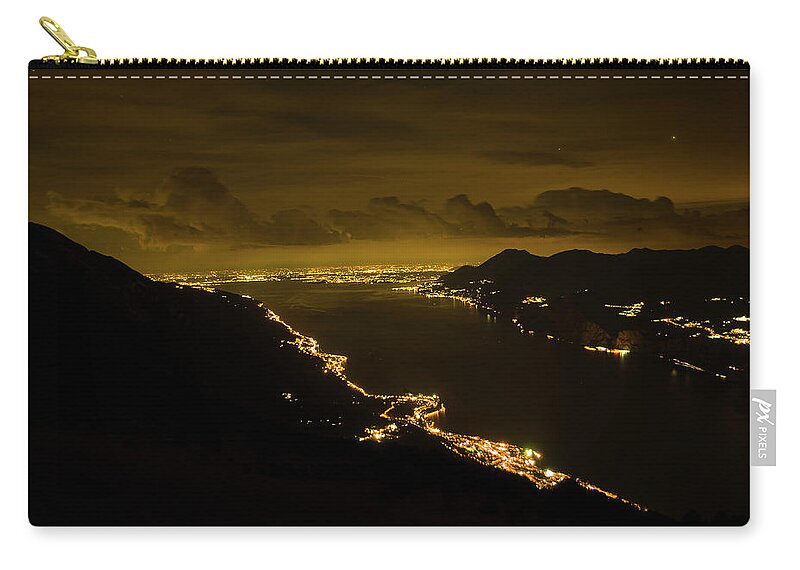 Night Zip Pouch featuring the photograph Night view of lkae Garda from Monte Baldo by Nicola Aristolao