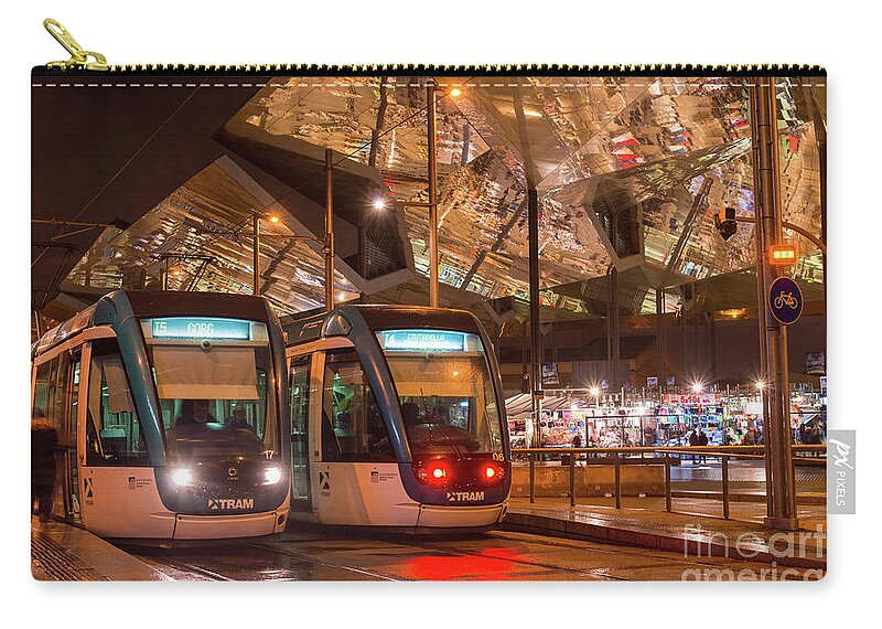 Glories Zip Pouch featuring the photograph Night view of two trams at Glories station by Andrew Michael