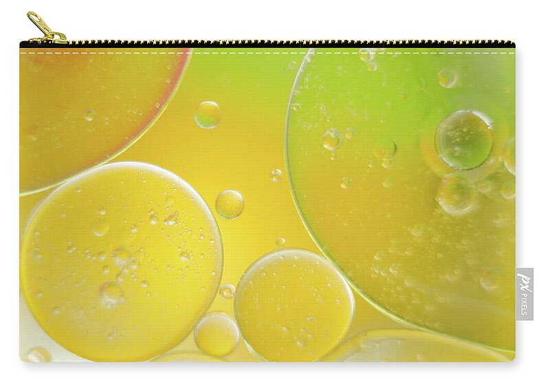 Water Carry-all Pouch featuring the photograph Oil and water bubbles by Andy Myatt