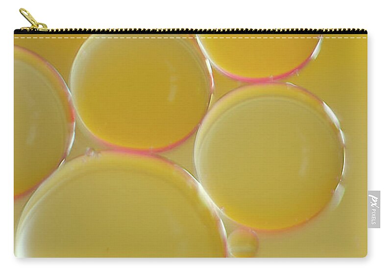 Water Carry-all Pouch featuring the photograph Oil bubbles on water abstract by Andy Myatt
