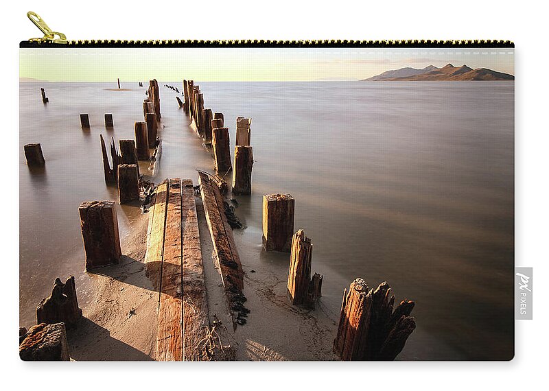 Utah; Abstract; Landscape; Great Salt Lake; Sunset; Salt; Orange; Pink; Red; Lake; Water; Reflection; Waves Zip Pouch featuring the photograph Old Floating Pier Sunset by Brett Pelletier
