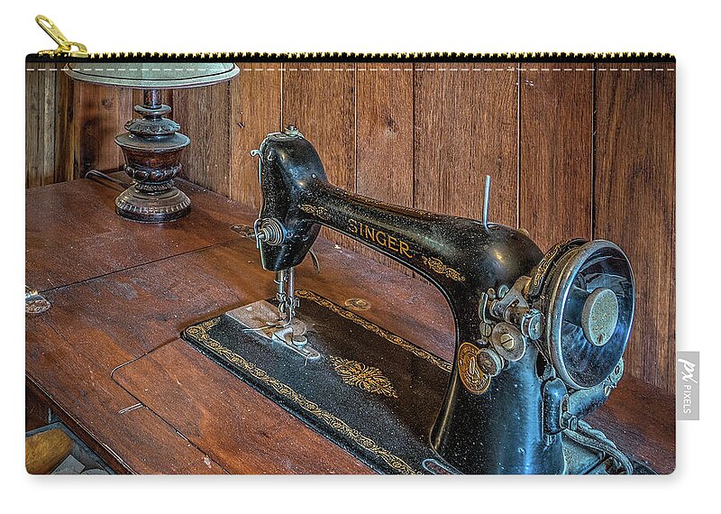 Antique Zip Pouch featuring the photograph Old sewing machine by Izet Kapetanovic