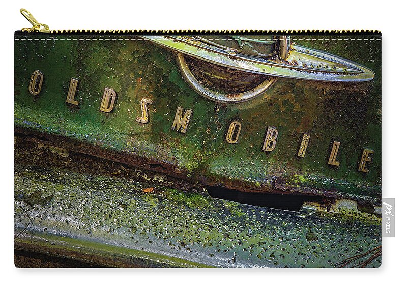 Old Car City Carry-all Pouch featuring the photograph Oldsmobile by Doug Sturgess