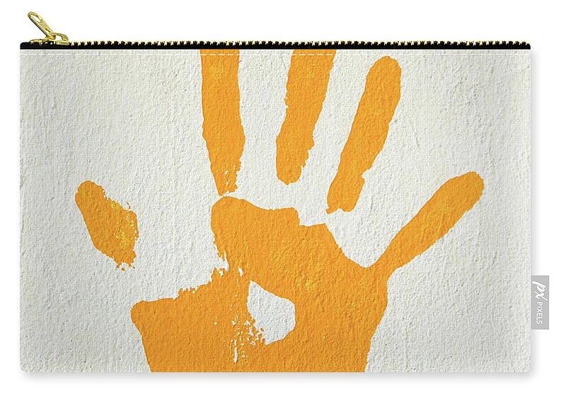 Print Zip Pouch featuring the photograph Orange handprint on a wall by Dutourdumonde Photography