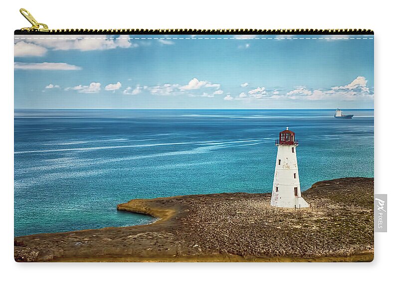 Lighthouse Zip Pouch featuring the photograph Paradise Island Lighthouse by Mick Burkey