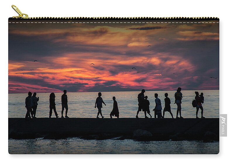 Art Zip Pouch featuring the photograph People walking on the Breakwater at Ottawa Beach at Sunset by Randall Nyhof