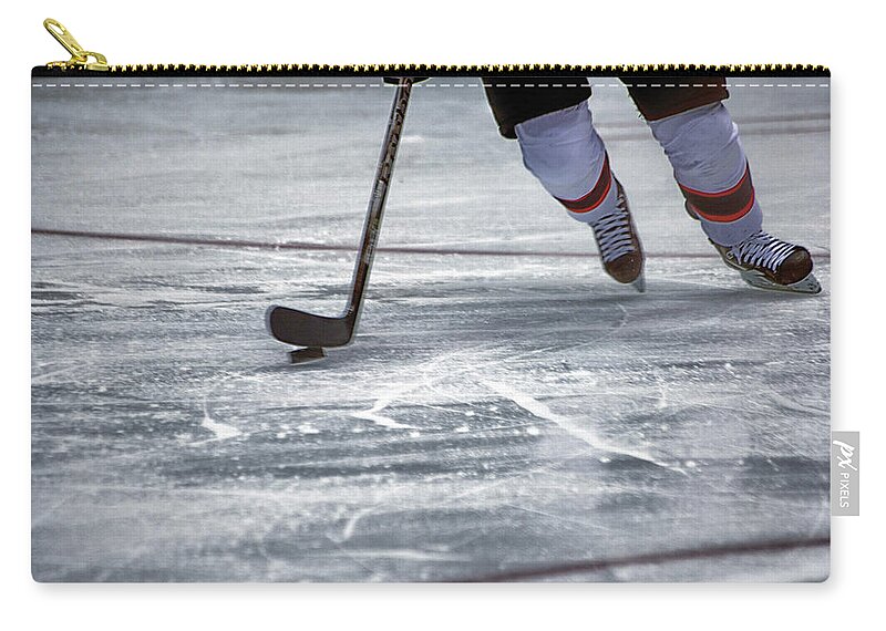 Hockey Zip Pouch featuring the photograph Player and Puck by Karol Livote