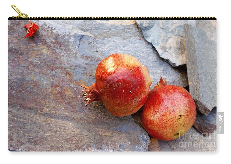  Zip Pouch featuring the photograph Pomegranates on stone by Cindy Garber Iverson