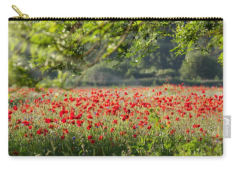 Field Zip Pouch featuring the photograph Poppy field panorama in spring by Simon Bratt