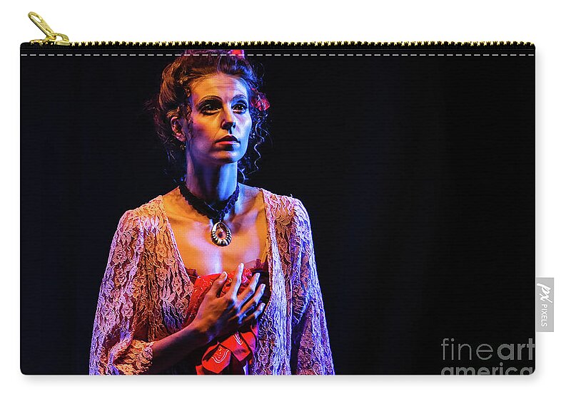Ballet Carry-all Pouch featuring the photograph Portrait of ballet dancer in pose on stage by Dimitar Hristov