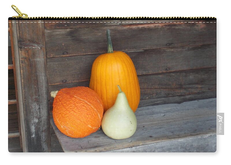 Shelburne Zip Pouch featuring the photograph Pumpkin on a Bench by Catherine Gagne
