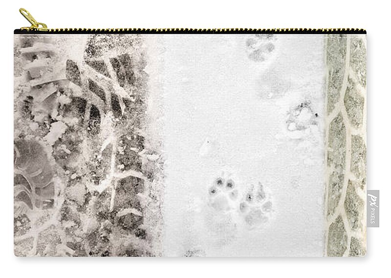 Winter Zip Pouch featuring the photograph Puppy Prints in the Snow by Lynn Hansen