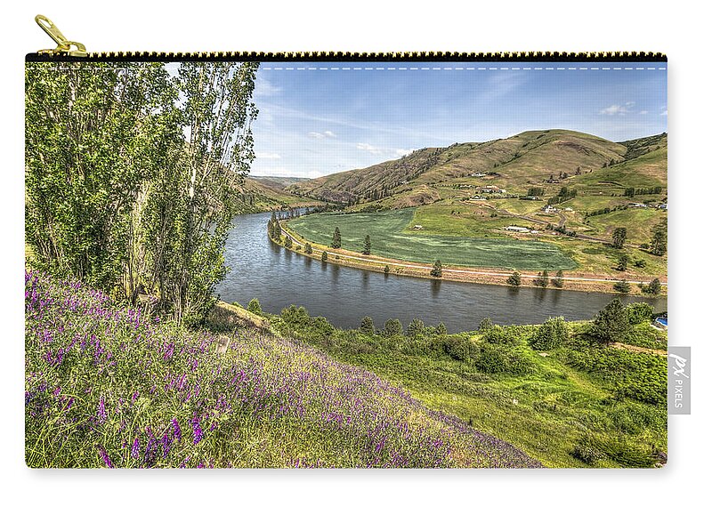 Purple Zip Pouch featuring the photograph Purple Wildflowers on the Hillside by Brad Stinson