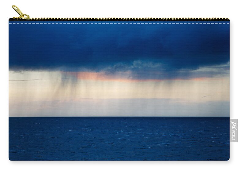 Rain Zip Pouch featuring the photograph Rain on the horizon at Strumble Head by Ian Middleton