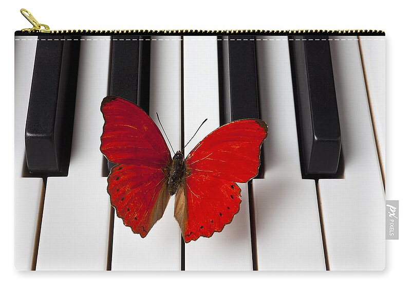 Red Butterfly Zip Pouch featuring the photograph Red Butterfly On Piano Keys by Garry Gay