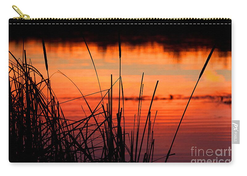 Sunsets Zip Pouch featuring the photograph Red Skies by Jim Garrison