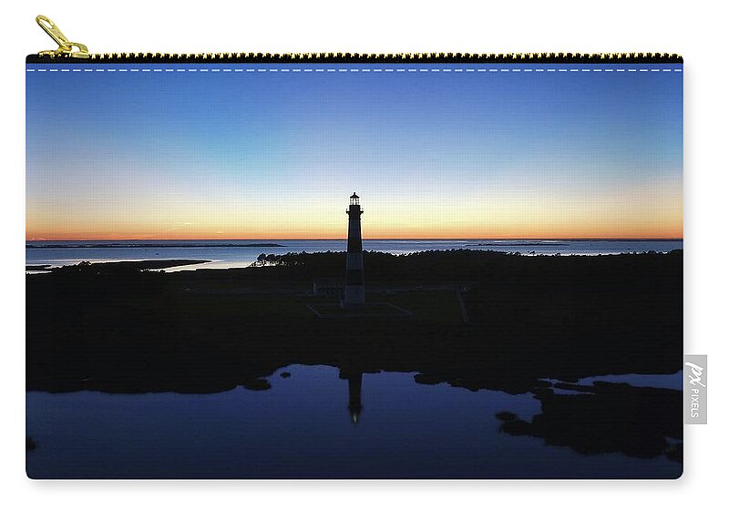 Photosbymch Zip Pouch featuring the photograph Reflection of Bodie Light at Sunset by M C Hood