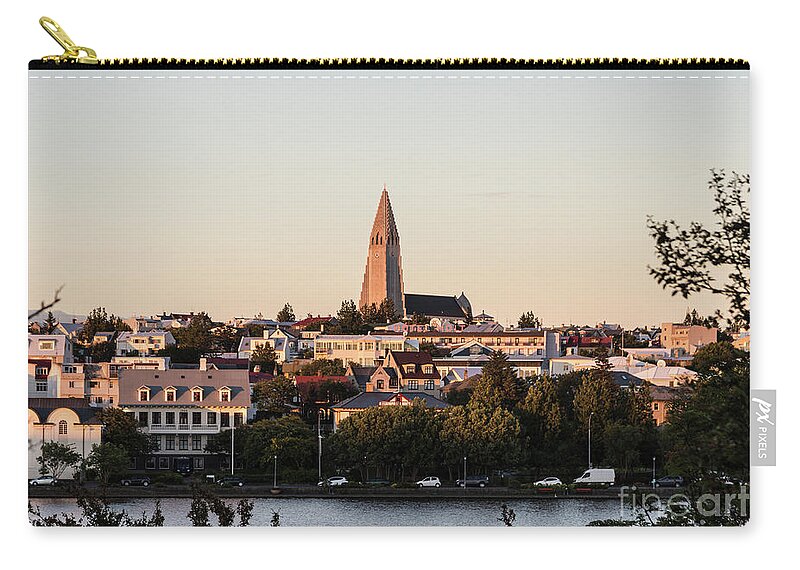 Hallgrimskirkja Zip Pouch featuring the photograph Reykjavik skyline by Didier Marti