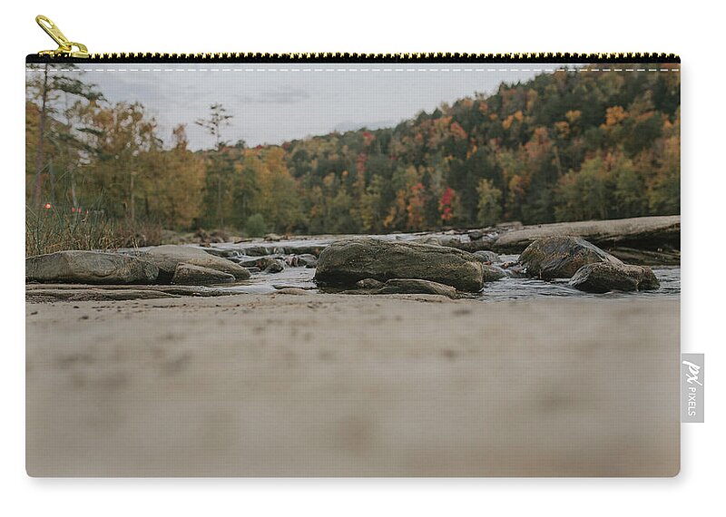 Cumberland Falls Zip Pouch featuring the photograph Rocks on Cumberland River by Amber Flowers