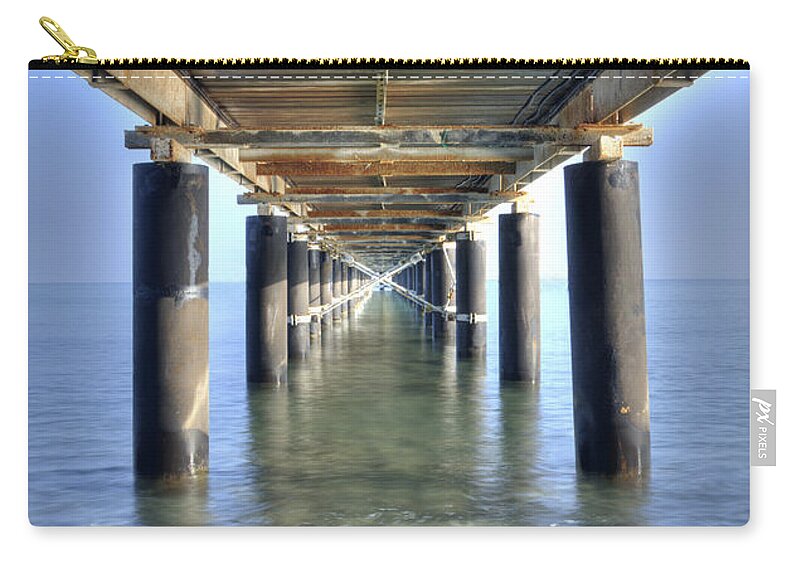 Dock Zip Pouch featuring the photograph Rusty Pier on the ocean by Michalakis Ppalis