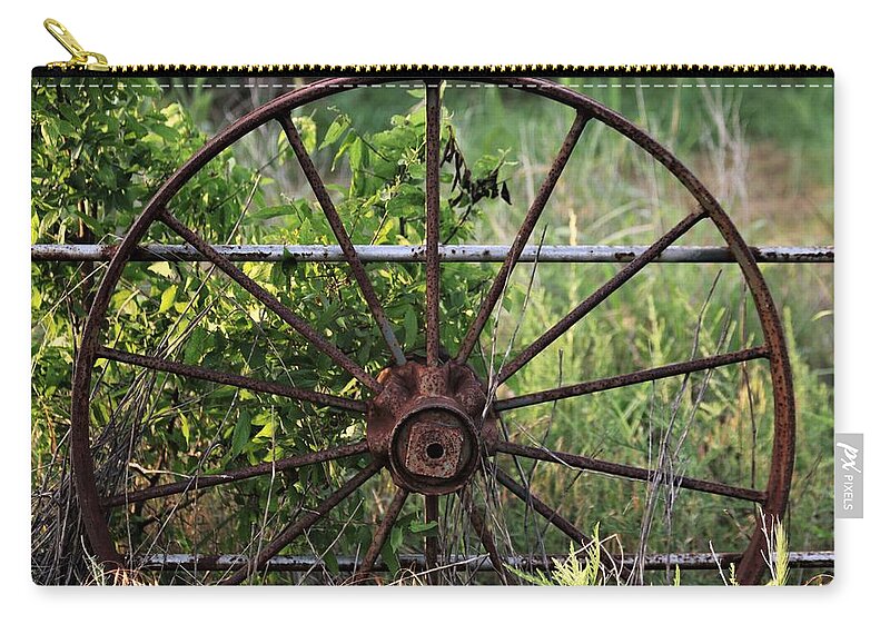 Objects Zip Pouch featuring the photograph Rusty Wagon Wheel on Fence by Sheila Brown