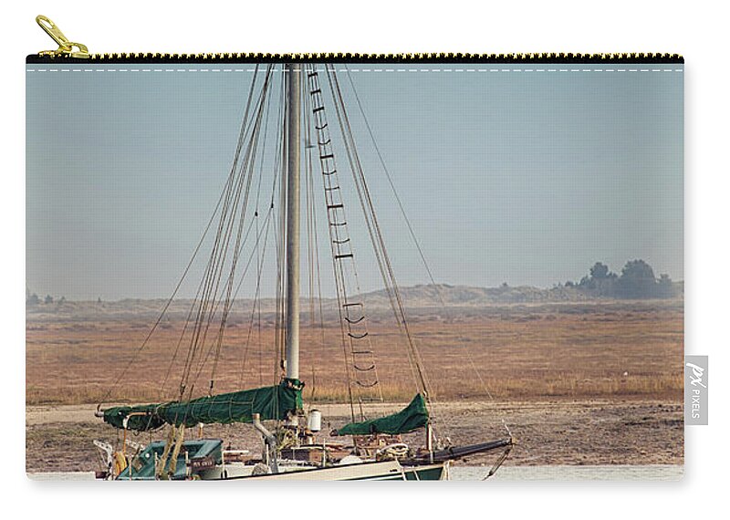 Wells Zip Pouch featuring the photograph Norfolk sail boat stranded at low tide by Simon Bratt