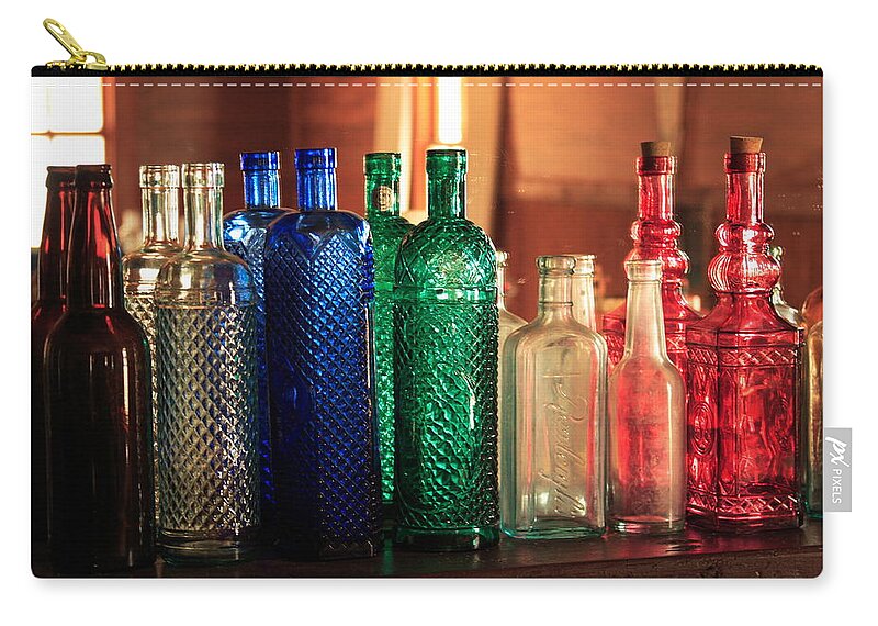 Bottles Zip Pouch featuring the photograph Saloon bottles by Toni Hopper