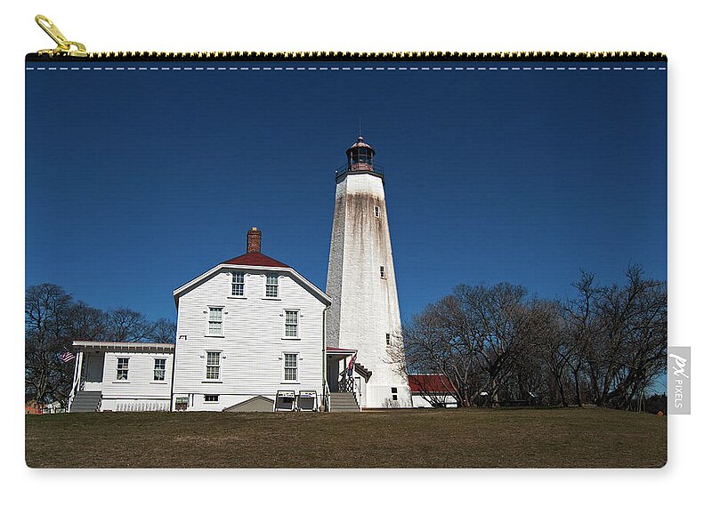 Lighthouse Zip Pouch featuring the photograph Sandy Hook Lighthouse by Elsa Santoro