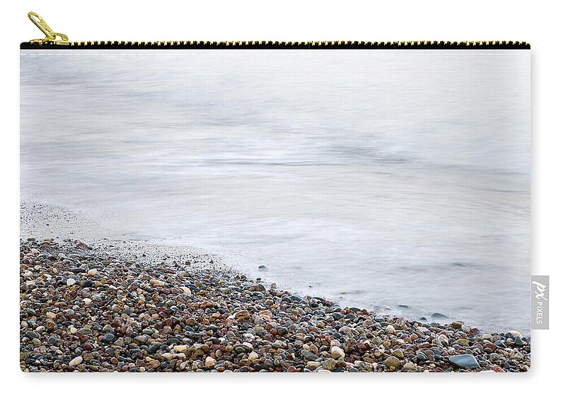 Beach Zip Pouch featuring the photograph Seashore waves and stones abstract by Michalakis Ppalis