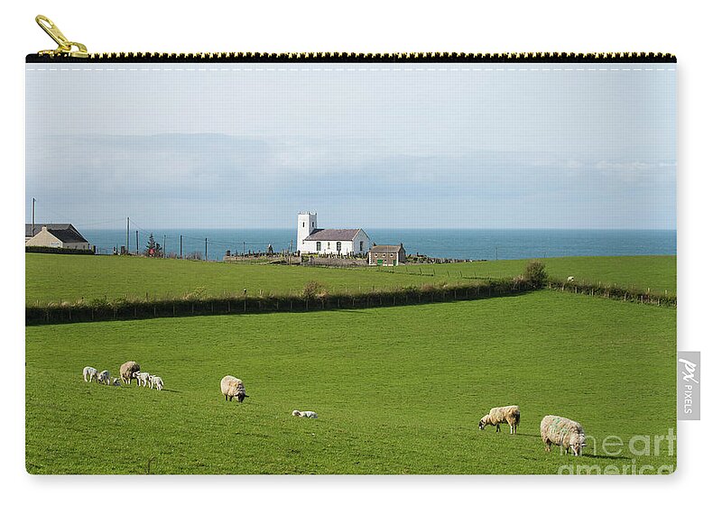 Ballintoy Zip Pouch featuring the photograph Sheep Grazing on Irish Coastline by Juli Scalzi