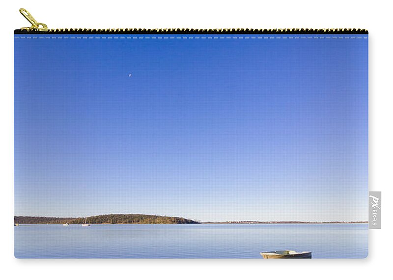 St. Helens Zip Pouch featuring the photograph Small boat anchored out to sea by Jorgo Photography