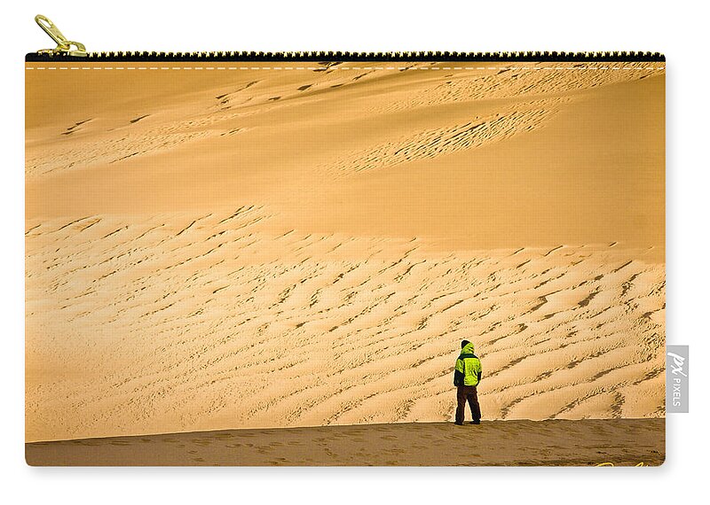 Colorado Zip Pouch featuring the photograph Solitude in the dunes by Rikk Flohr