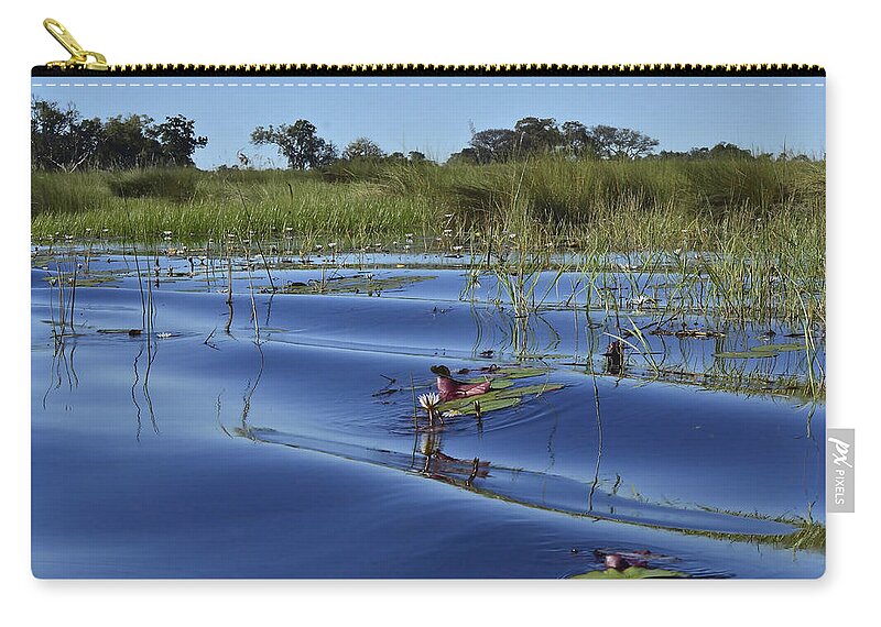 Okavango Delta Zip Pouch featuring the photograph Solitude in the Okavango by Don Mercer