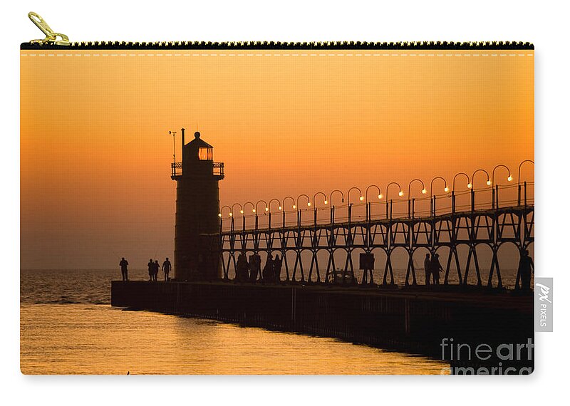 South Haven Lighthouse Carry-all Pouch featuring the photograph South Haven Light At Sunset by Rich S