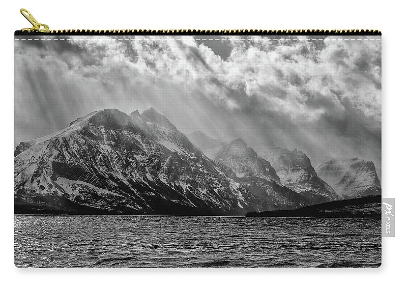 Light Rays Zip Pouch featuring the photograph St Mary storm, Glacier National Park by Greg Wyatt